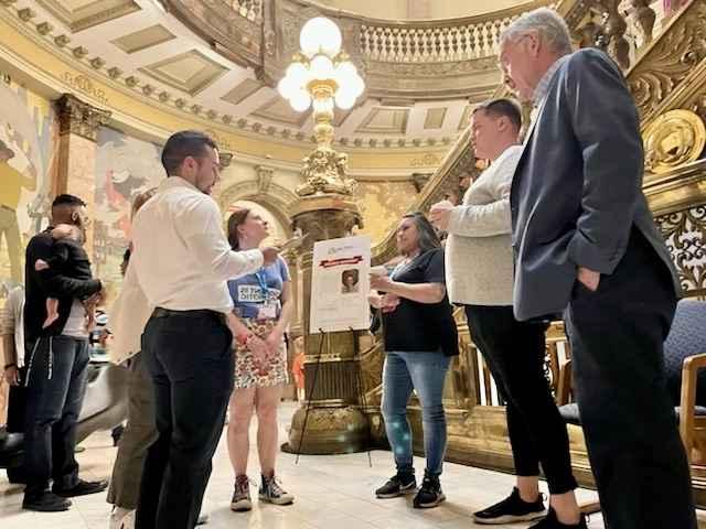 Julian Camera, ACLU of Colorado Field Organizer leading a tour group at the State Capitol during lobby week